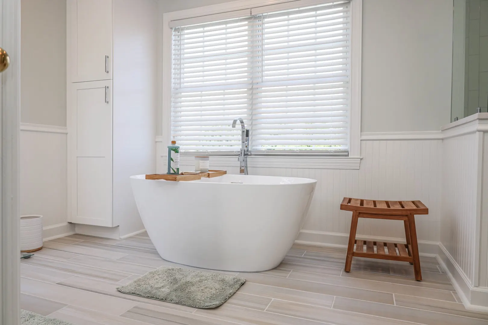Complete master bathroom remodeling in Marriottsville MD featuring two distinct vanities and a walk-in shower by Anka Design Studio.