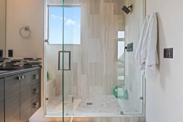 Open layout bathroom remodeling project completed by Anka Design Studio in the DMV area.